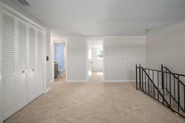 6841 Mitchell Cir, Tampa, FL 33634 - corridor with an upstairs landing, carpet flooring, and a textured ceiling