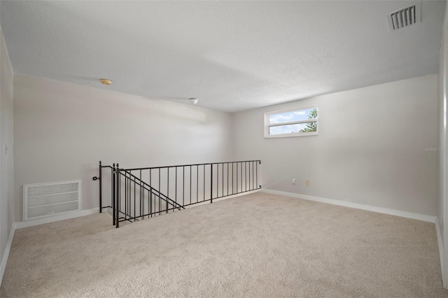 6841 Mitchell Cir, Tampa, FL 33634 - carpeted spare room featuring baseboards and a textured ceiling