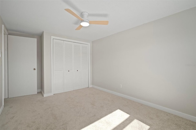 6841 Mitchell Cir, Tampa, FL 33634 - unfurnished bedroom with carpet, a closet, and ceiling fan