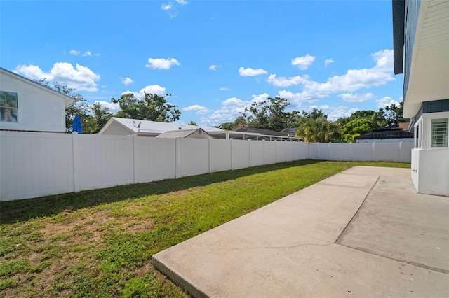 6841 Mitchell Cir, Tampa, FL 33634 - fenced backyard with a patio area
