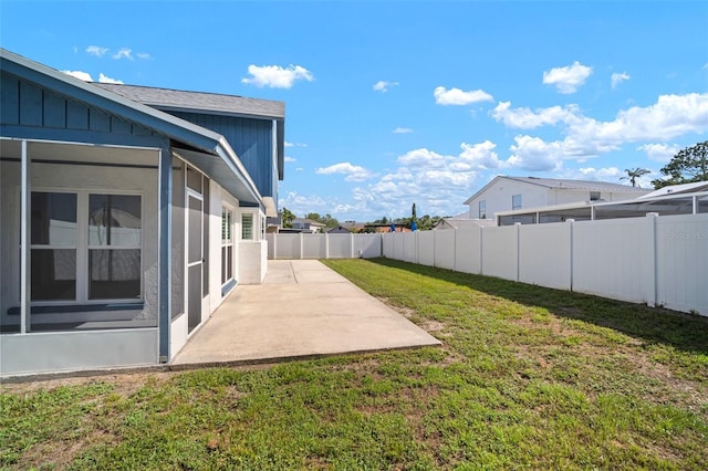 6841 Mitchell Cir, Tampa, FL 33634 - fenced backyard featuring a patio area