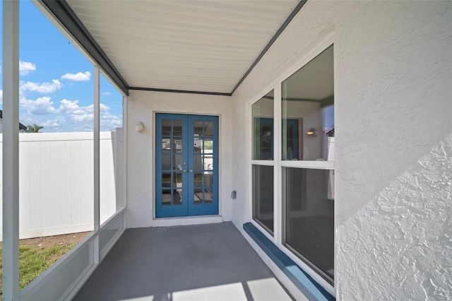 6841 Mitchell Cir, Tampa, FL 33634 - unfurnished sunroom with french doors
