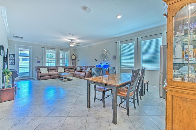 25200 Lambrusco Loop, Lutz, FL 33559 - dining area with ornamental molding, light tile patterned floors, and a ceiling fan