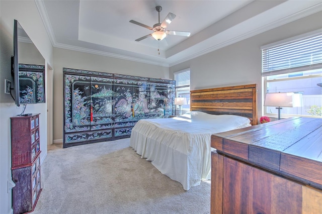 25200 Lambrusco Loop, Lutz, FL 33559 - carpeted bedroom featuring a tray ceiling, crown molding, and a ceiling fan