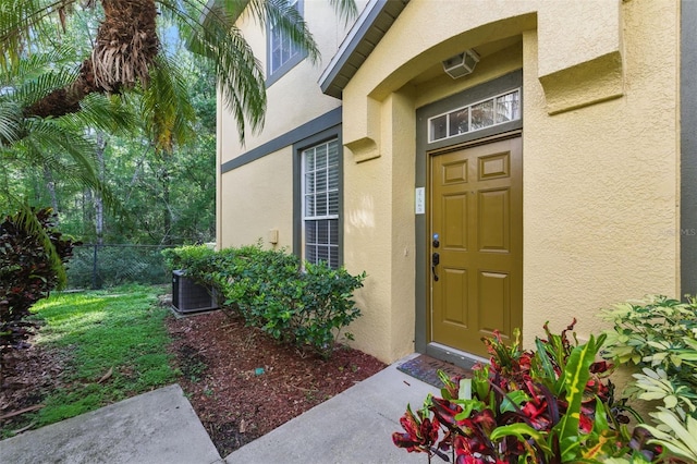 27563 Pleasure Ride Loop, Wesley Chapel, FL 33544 - doorway to property featuring stucco siding