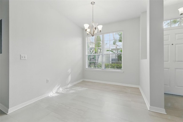 27563 Pleasure Ride Loop, Wesley Chapel, FL 33544 - unfurnished dining area featuring a chandelier and baseboards