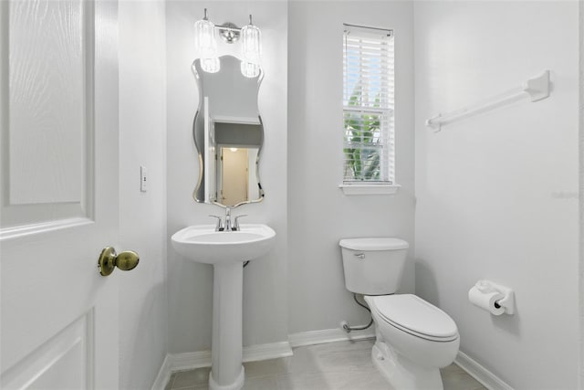 27563 Pleasure Ride Loop, Wesley Chapel, FL 33544 - half bath with toilet and tile patterned floors