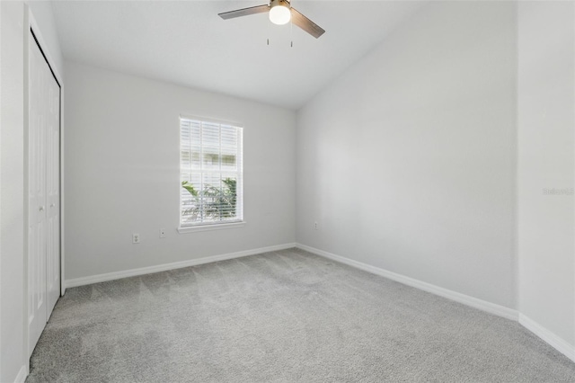 27563 Pleasure Ride Loop, Wesley Chapel, FL 33544 - unfurnished bedroom with light colored carpet, lofted ceiling, a closet, and ceiling fan