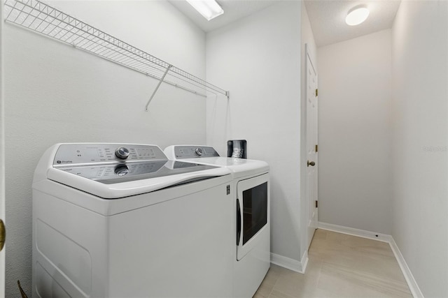27563 Pleasure Ride Loop, Wesley Chapel, FL 33544 - laundry area featuring independent washer and dryer and baseboards
