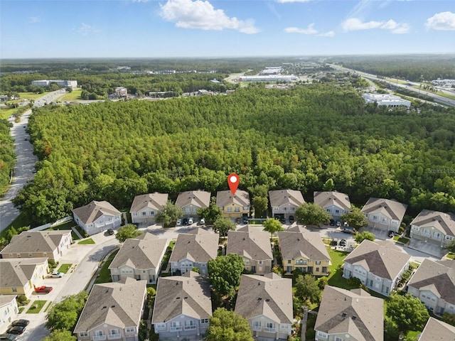 27563 Pleasure Ride Loop, Wesley Chapel, FL 33544 - aerial perspective of suburban area with a heavily wooded area