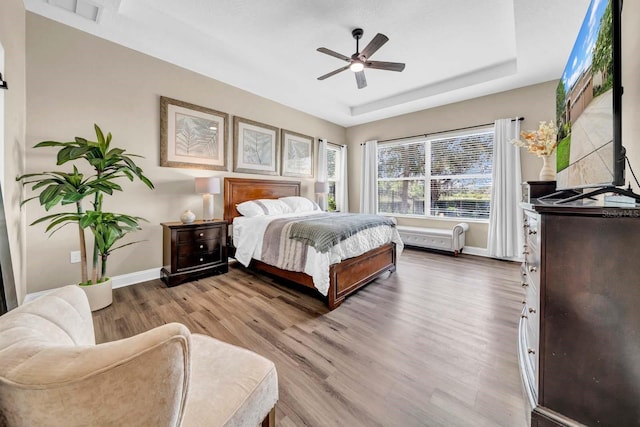 32624 Summerglade Dr, Wesley Chapel, FL 33545 - bedroom featuring wood finished floors and ceiling fan