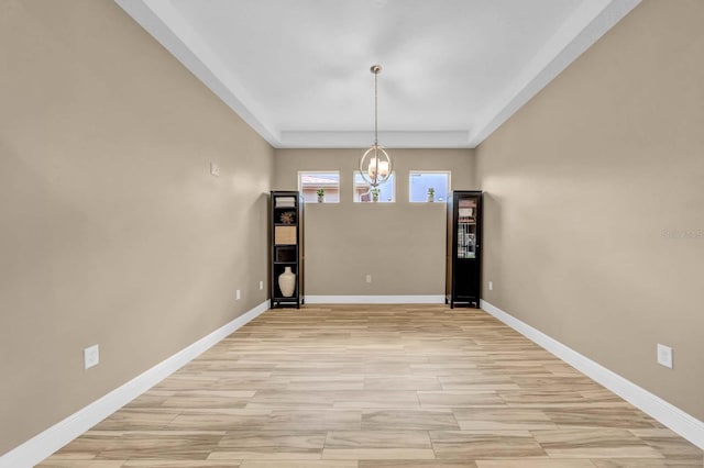 32624 Summerglade Dr, Wesley Chapel, FL 33545 - unfurnished dining area with a chandelier and light wood finished floors