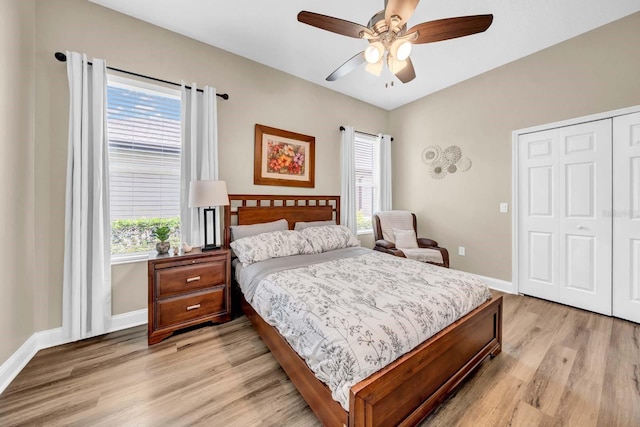 32624 Summerglade Dr, Wesley Chapel, FL 33545 - bedroom with multiple windows, light wood finished floors, a closet, and ceiling fan