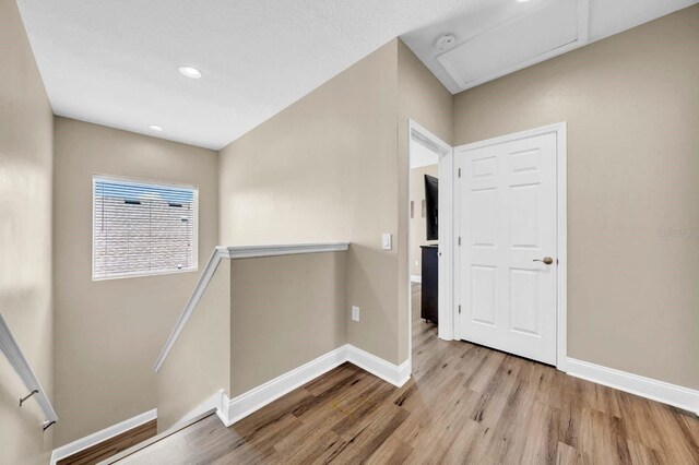 32624 Summerglade Dr, Wesley Chapel, FL 33545 - corridor featuring an upstairs landing, wood finished floors, attic access, and recessed lighting