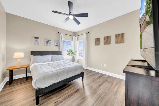 32624 Summerglade Dr, Wesley Chapel, FL 33545 - bedroom with light wood-style flooring and a ceiling fan