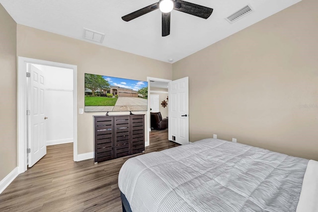 32624 Summerglade Dr, Wesley Chapel, FL 33545 - bedroom featuring wood finished floors and a ceiling fan