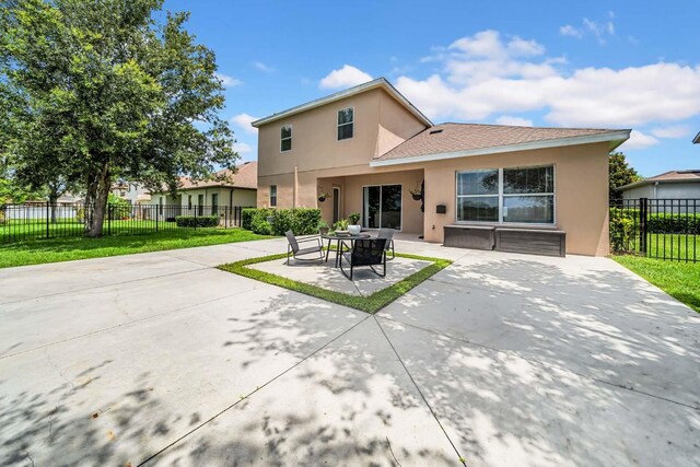 32624 Summerglade Dr, Wesley Chapel, FL 33545 - back of property featuring stucco siding and a patio