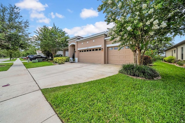 32624 Summerglade Dr, Wesley Chapel, FL 33545 - view of property hidden behind natural elements featuring stucco siding, a garage, a front yard, and driveway