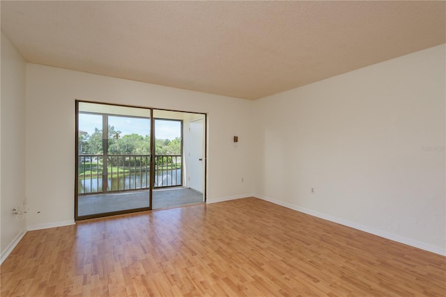2650 Countryside Blvd Unit C204, Clearwater, FL 33761 - spare room featuring light wood-style floors and baseboards