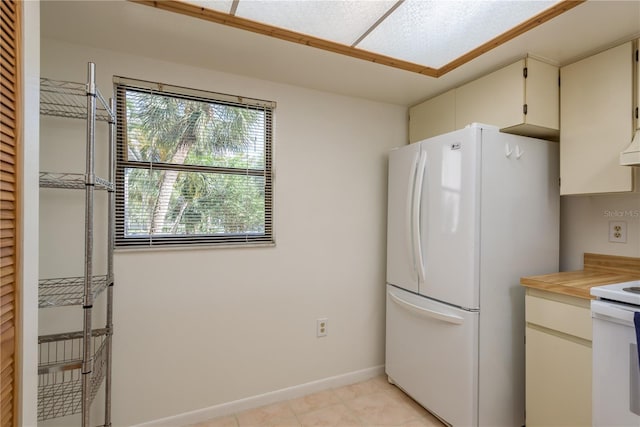 2650 Countryside Blvd Unit C204, Clearwater, FL 33761 - kitchen featuring white appliances and light tile patterned floors
