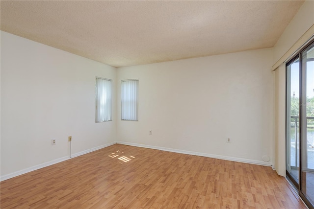 2650 Countryside Blvd Unit C204, Clearwater, FL 33761 - empty room with light wood-style floors and a textured ceiling