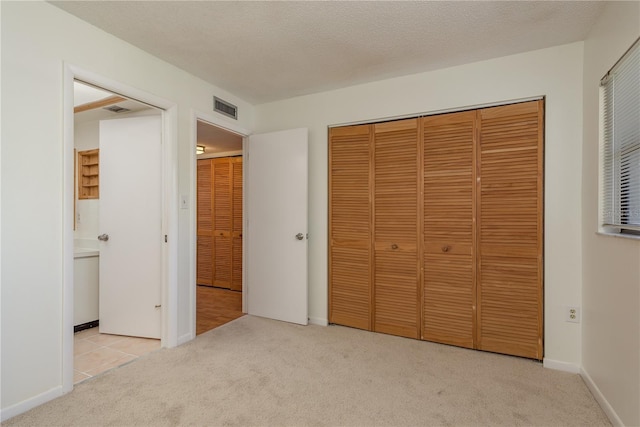 2650 Countryside Blvd Unit C204, Clearwater, FL 33761 - unfurnished bedroom with carpet floors and a closet