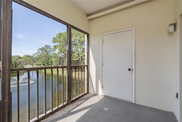 2650 Countryside Blvd Unit C204, Clearwater, FL 33761 - unfurnished sunroom featuring a water view