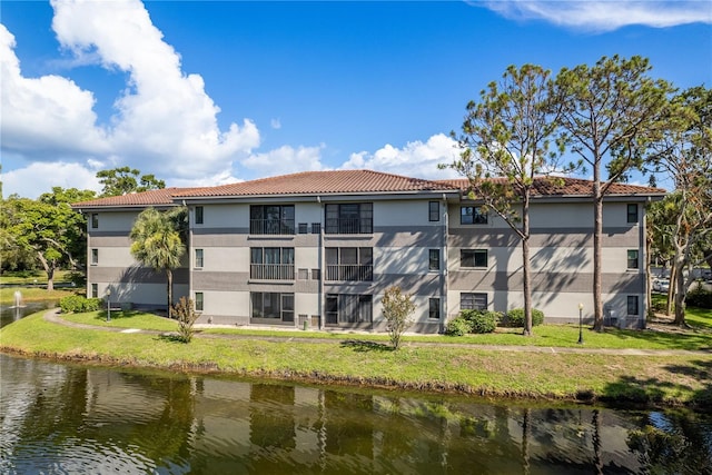 2650 Countryside Blvd Unit C204, Clearwater, FL 33761 - view of building exterior with a water view