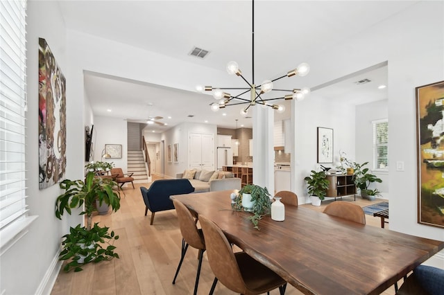 238 7th Ave S, Safety Harbor, FL 34695 - dining space with stairway, light wood-style floors, a chandelier, and recessed lighting