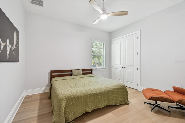 238 7th Ave S, Safety Harbor, FL 34695 - bedroom with light wood finished floors, a closet, and ceiling fan