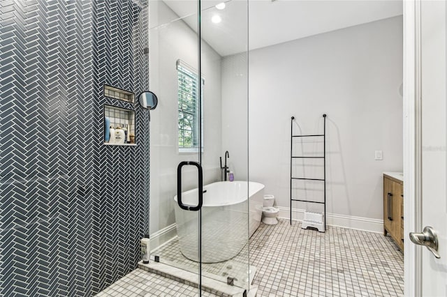 238 7th Ave S, Safety Harbor, FL 34695 - full bathroom featuring vanity, a freestanding tub, a shower stall, tile patterned floors, and recessed lighting