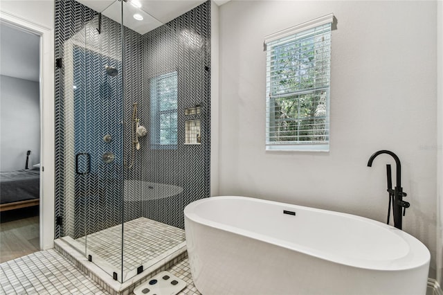 238 7th Ave S, Safety Harbor, FL 34695 - full bathroom with a soaking tub, a stall shower, and tile patterned floors