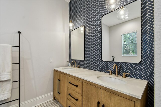 238 7th Ave S, Safety Harbor, FL 34695 - bathroom with double vanity, tasteful backsplash, and tile patterned flooring