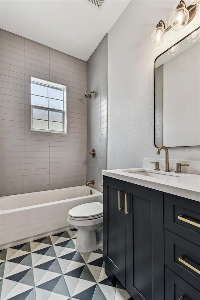 238 7th Ave S, Safety Harbor, FL 34695 - bathroom with tile patterned floors, vanity, and washtub / shower combination
