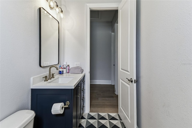 238 7th Ave S, Safety Harbor, FL 34695 - half bathroom with vanity and wood finished floors