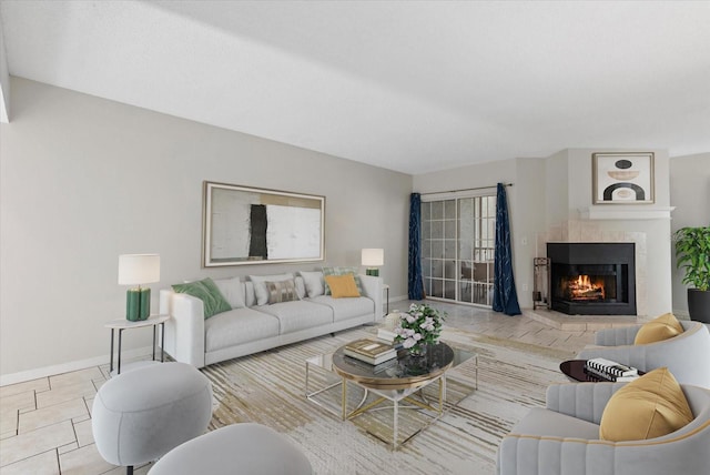 4777 Duhme Rd Unit 1D, Saint Petersburg, FL 33708 - tiled living room with a fireplace and baseboards