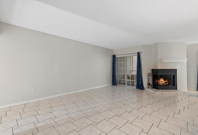 4777 Duhme Rd Unit 1D, Saint Petersburg, FL 33708 - unfurnished living room with a lit fireplace and baseboards