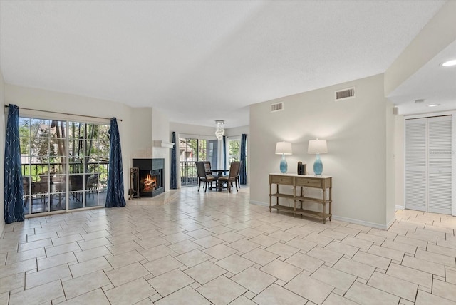 4777 Duhme Rd Unit 1D, Saint Petersburg, FL 33708 - living area with a tiled fireplace and baseboards