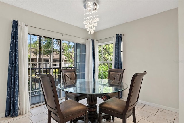 4777 Duhme Rd Unit 1D, Saint Petersburg, FL 33708 - dining space with light tile patterned flooring and a chandelier