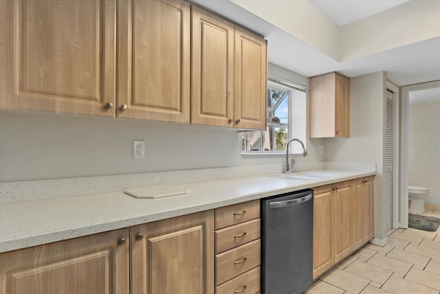 4777 Duhme Rd Unit 1D, Saint Petersburg, FL 33708 - kitchen with stainless steel dishwasher, light brown cabinets, light stone countertops, and light tile patterned flooring