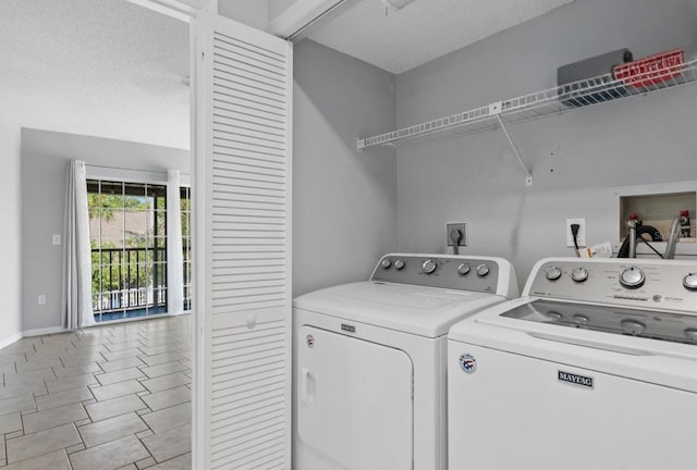 4777 Duhme Rd Unit 1D, Saint Petersburg, FL 33708 - laundry area with independent washer and dryer and baseboards