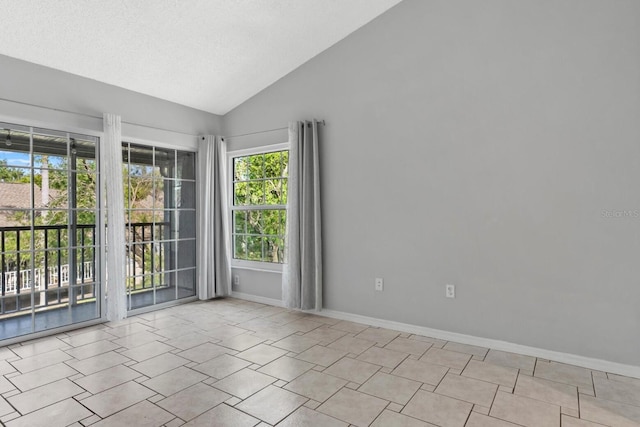 4777 Duhme Rd Unit 1D, Saint Petersburg, FL 33708 - unfurnished room featuring plenty of natural light and vaulted ceiling