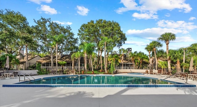 4777 Duhme Rd Unit 1D, Saint Petersburg, FL 33708 - community pool featuring a hot tub and a patio area