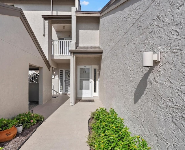 4777 Duhme Rd Unit 1D, Saint Petersburg, FL 33708 - doorway to property featuring a balcony and stucco siding