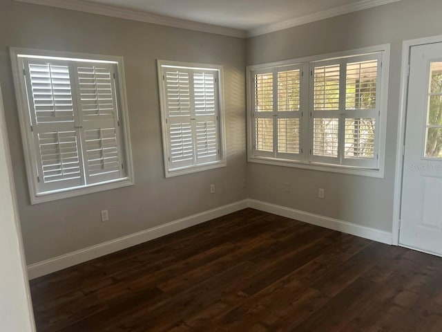 8033 55th St E, Palmetto, FL 34221 - empty room with dark wood-style flooring, healthy amount of natural light, and crown molding