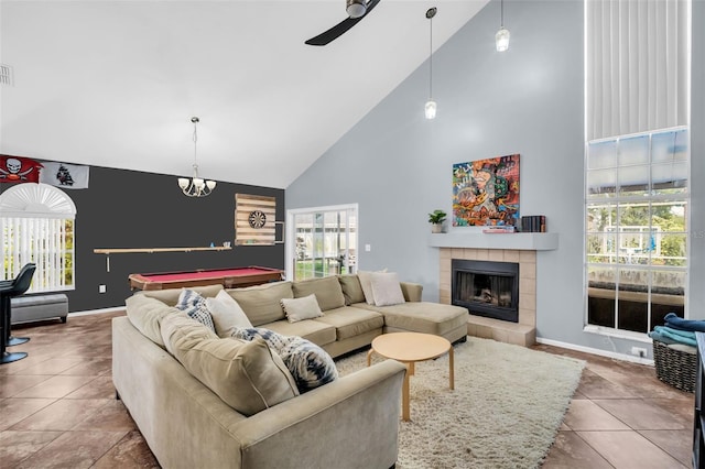 1715 Larabie Ct, Brandon, FL 33511 - tiled living area with high vaulted ceiling, healthy amount of natural light, a tiled fireplace, pool table, and ceiling fan