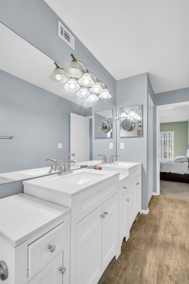 1715 Larabie Ct, Brandon, FL 33511 - ensuite bathroom featuring double vanity and wood finished floors