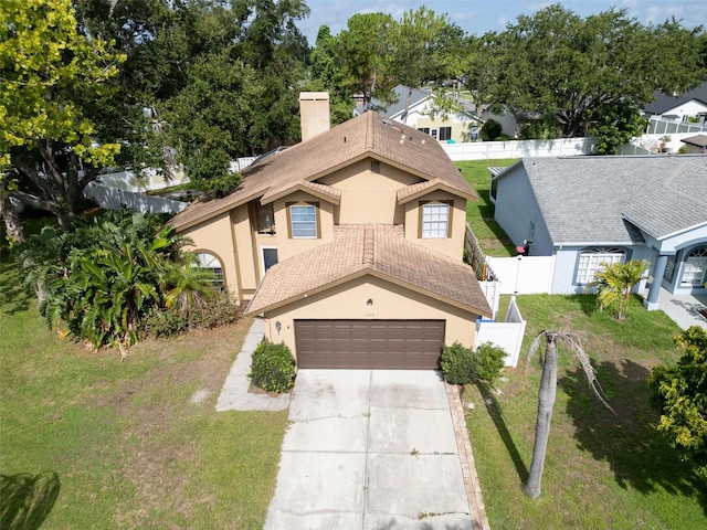 1715 Larabie Ct, Brandon, FL 33511 - view of front of home featuring stucco siding, a chimney, an attached garage, concrete driveway, and a fenced backyard