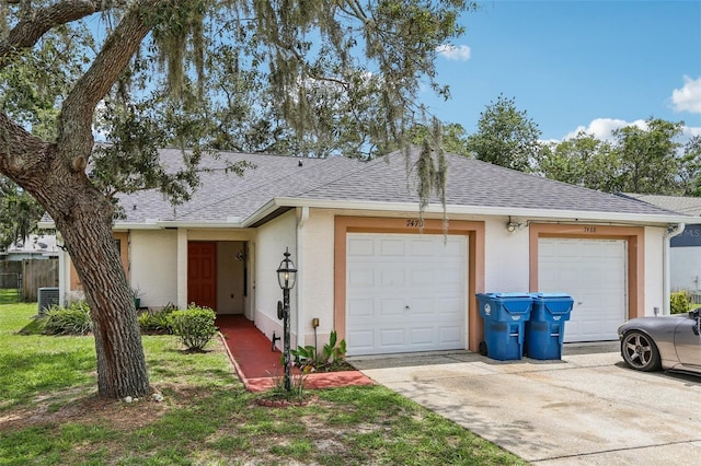 7470 Canterbury St, Spring Hill, FL 34606 - view of front of property with a shingled roof, stucco siding, concrete driveway, and a garage