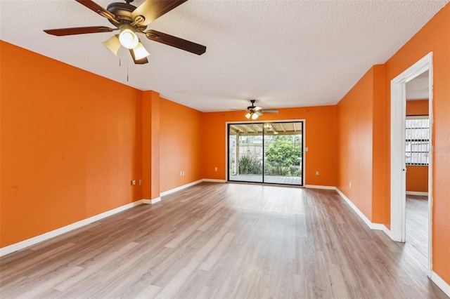 7470 Canterbury St, Spring Hill, FL 34606 - unfurnished room featuring wood finished floors, a ceiling fan, and a textured ceiling